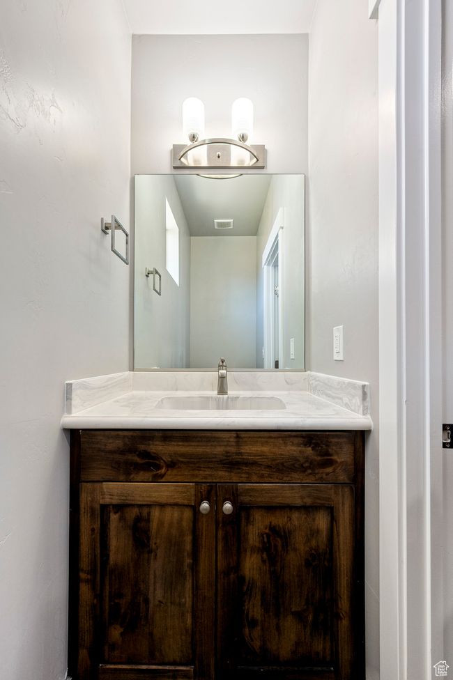 Bathroom featuring visible vents and vanity | Image 47