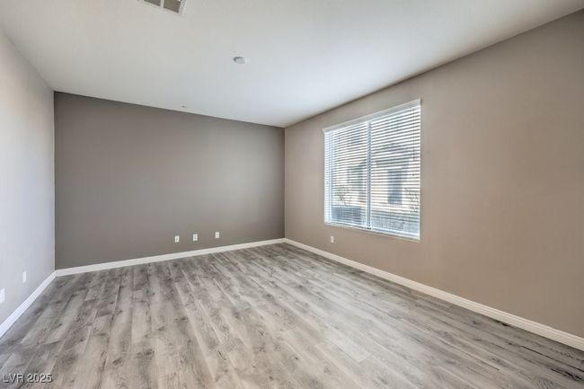 Empty room featuring baseboards, visible vents, and wood finished floors | Image 10