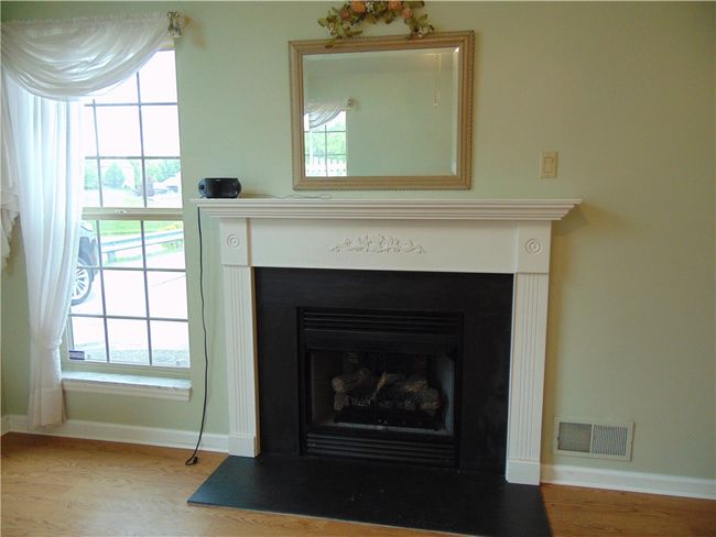 Gas fireplace with decorative mantle | Image 10
