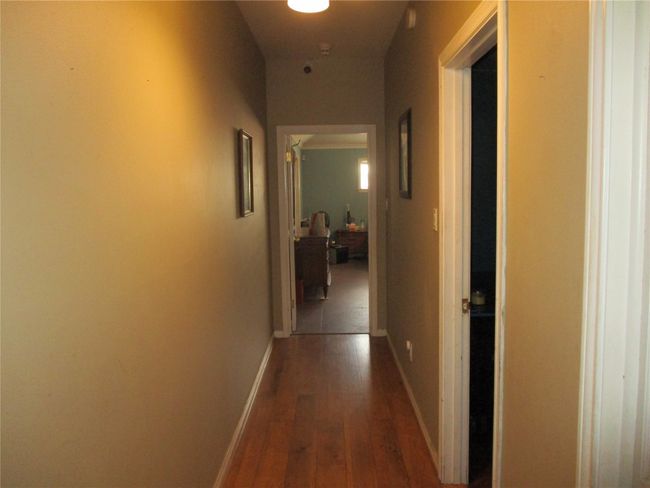 Hallway with wood-type flooring | Image 30