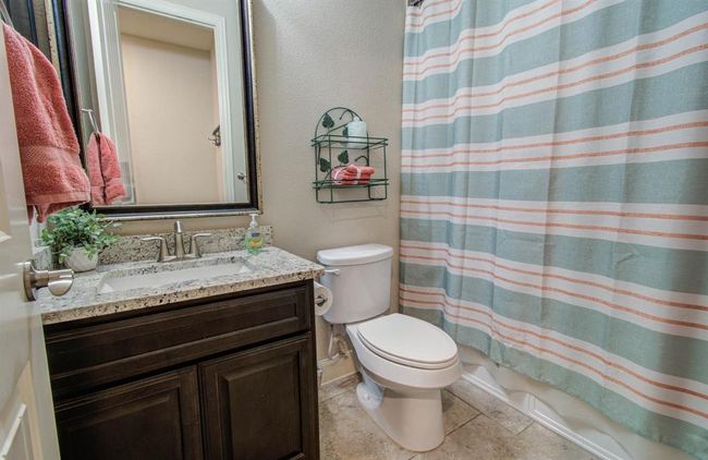 Full bathroom downstairs has shower/tub combo. | Image 40