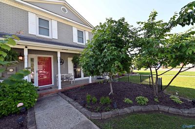 This lovely town home is 2 story, with brick and wood exterior. NO HOA! 3 bed2/5 bath. Spacious living room. Kitchen with granite counter tops, new tile flooring. Carpet in bedrooms only. A cozy space to sit and read(not included in square footage). | Image 3