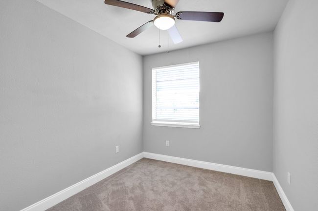 3rd bedroom with new carpet, paint, fan and blinds. | Image 17