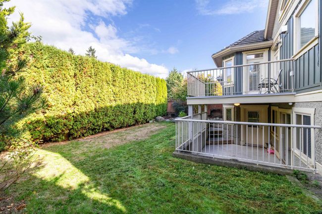 View of yard with a balcony | Image 10
