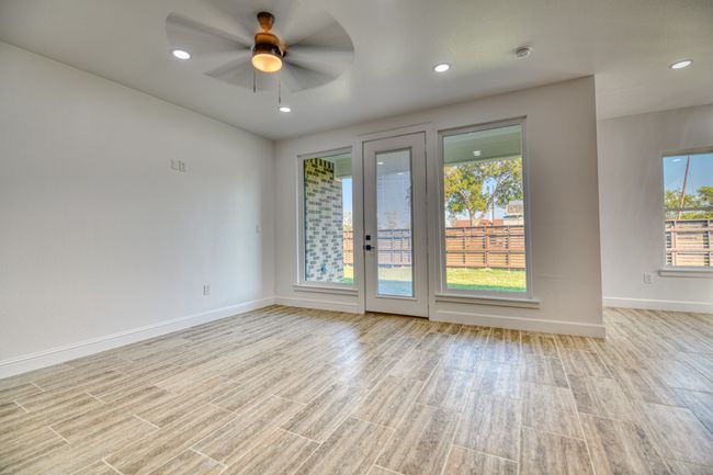 Empty room featuring light hardwood / wood-style flooring and ceiling fan | Image 22