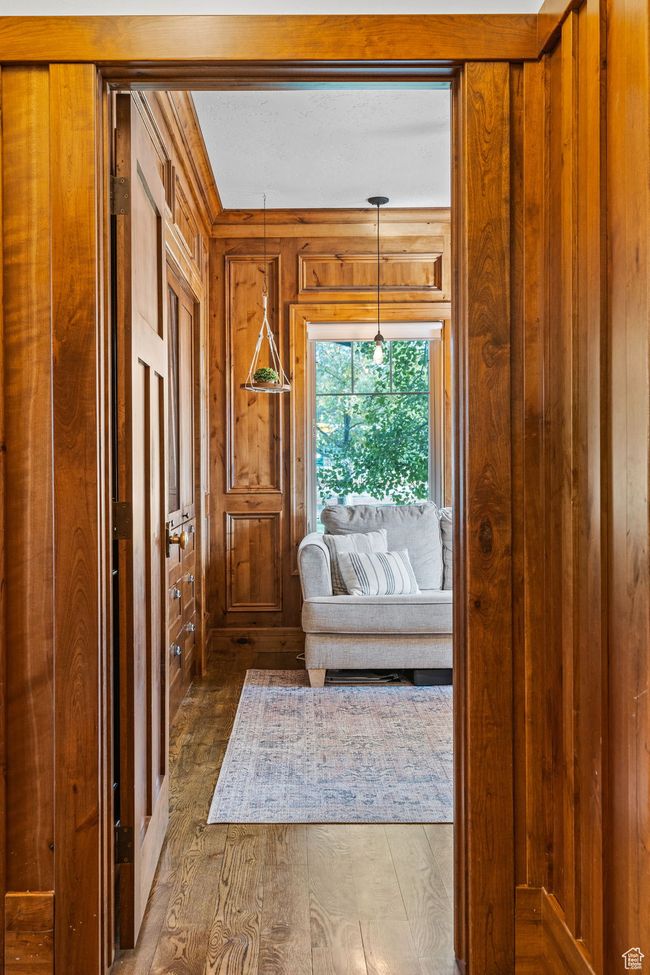 Interior space with hardwood / wood-style flooring and wood walls | Image 23