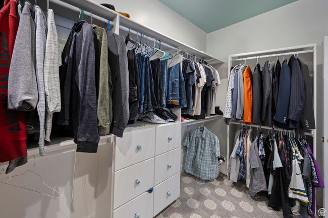 Walk in closet featuring carpet flooring | Image 38