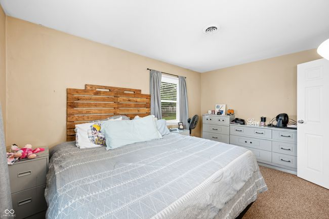 bedroom featuring visible vents and carpet | Image 27