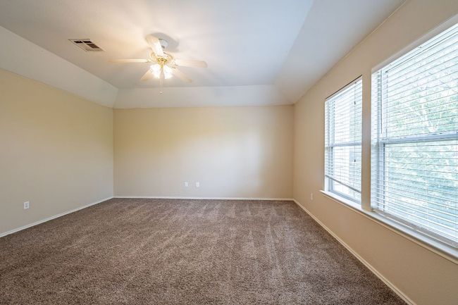 Empty room featuring a ceiling fan, carpet flooring, and baseboards | Image 16