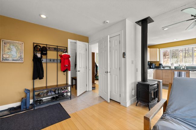 Wood stove and light wood-style flooring | Image 29