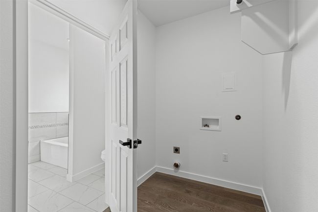 Laundry area with electric dryer hookup, hookup for a washing machine, baseboards, and laundry area | Image 22