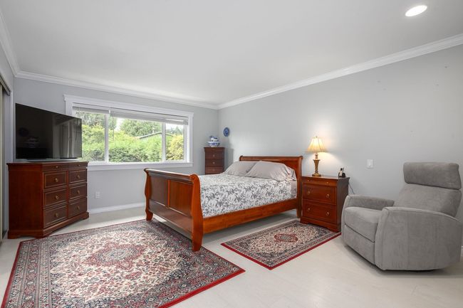 Bedroom featuring ornamental molding and baseboards | Image 15
