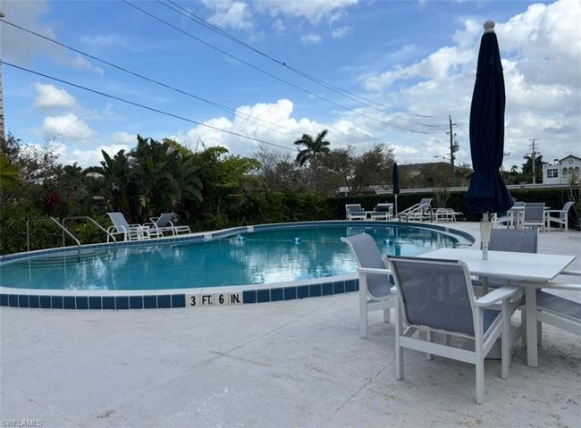 Community pool featuring a patio area | Image 17