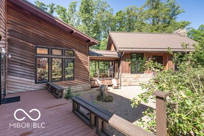 Exterior View - This gorgeous Brown County ridgetop home has been expanded several times over the years, and wraps around a central gravel courtyard. | Image 1