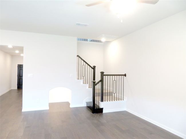 Stairway to the upstairs game room and 3 bedrooms | Image 10