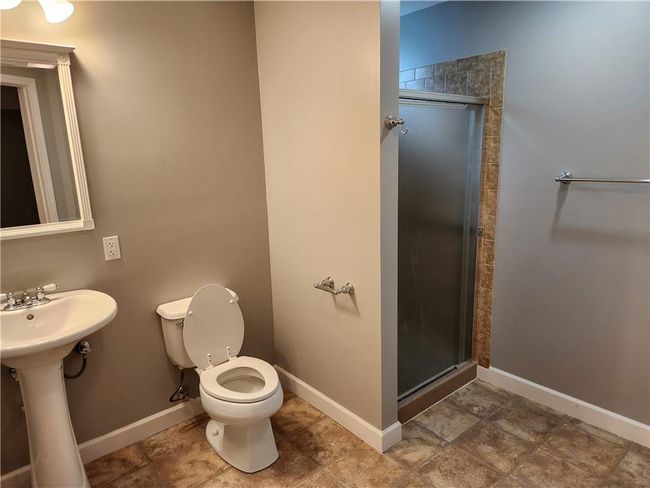 Bathroom with baseboards and a stall shower | Image 17