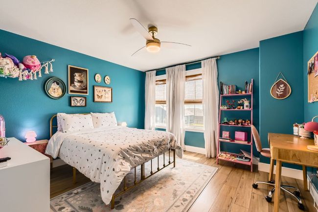 Bedroom featuring light wood-type flooring and a ceiling fan | Image 21