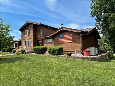 More pics of backside of home with beautiful landscaping | Image 3