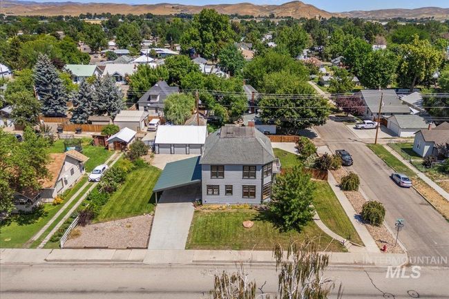 Aerial view of residential area featuring mountains | Image 4