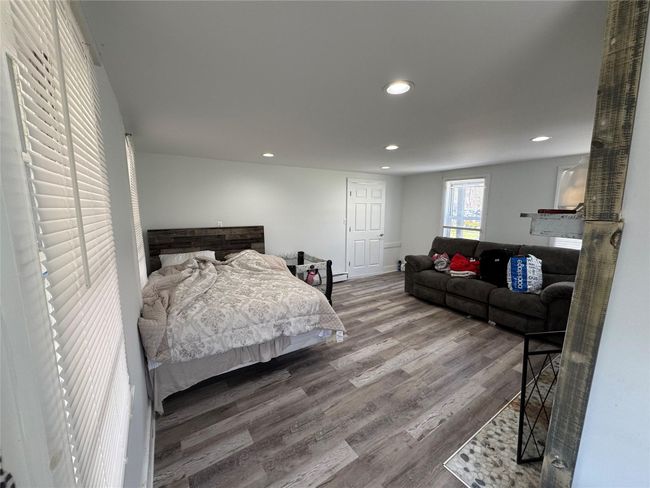 Bedroom featuring wood finished floors and recessed lighting | Image 5
