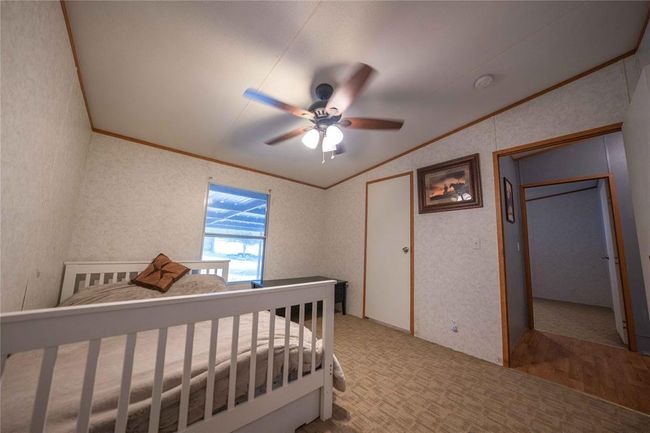 Bedroom featuring ceiling fan and vaulted ceiling | Image 21