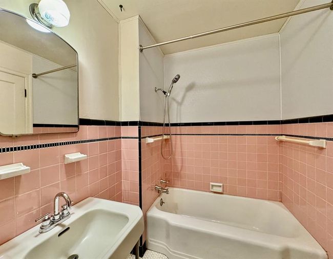 Full bath with tile walls and bathing tub / shower combination | Image 22