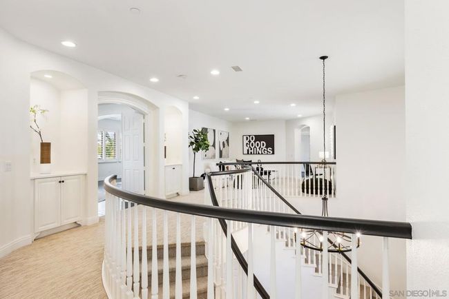 2nd floor landing area with views to the primary bedroom and the loft area. | Image 26