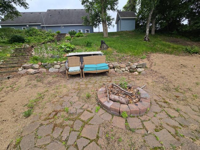 Steps down from the house to the sandy beach and firepit | Image 32