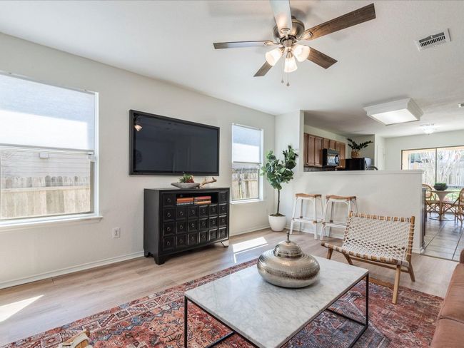 Inside, you’ll find a bright, open layout with light-colored luxury vinyl plank flooring. | Image 10