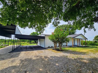 View of front of house featuring a carport | Image 1