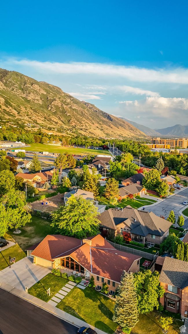 Aerial view of residential area featuring a mountainous background | Image 43