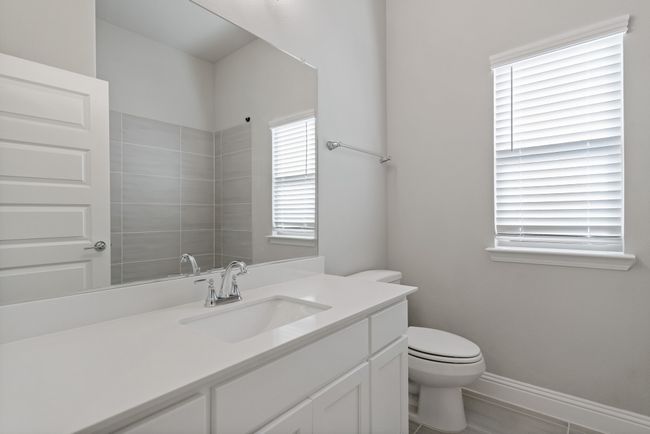 Bathroom with toilet, vanity, and baseboards | Image 26
