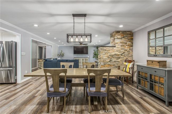 A view of the dining room and living room from the family room | Image 11
