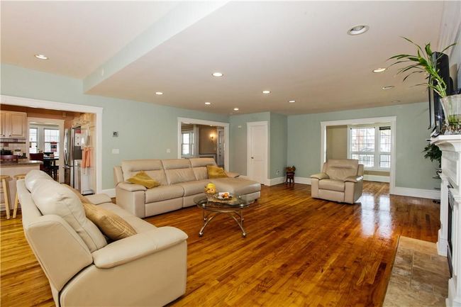 Another view of the family room with a view to the kitchen. | Image 6