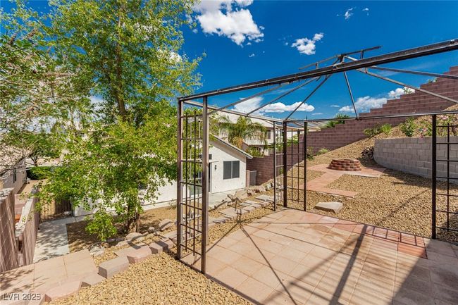 View of raised patio with a fenced backyard | Image 31