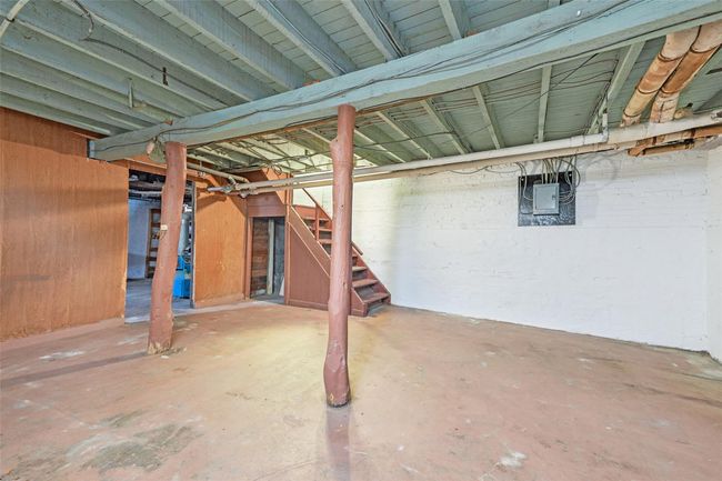 Unfinished basement featuring stairway | Image 34