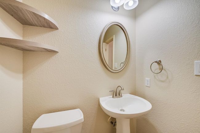 Bathroom featuring toilet and a sink | Image 32