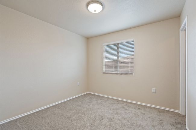 Carpeted spare room featuring baseboards | Image 25