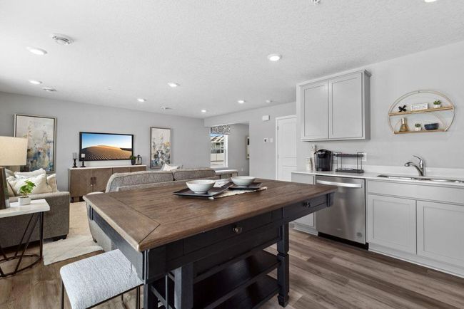 Open concept living with many ways to arrange furniture. Photo is of model home. Colors and options may vary. Ask Sales Agent for details. | Image 7