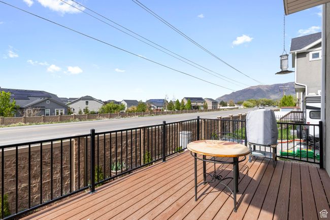 Wooden deck featuring a mountain view and a residential view | Image 26