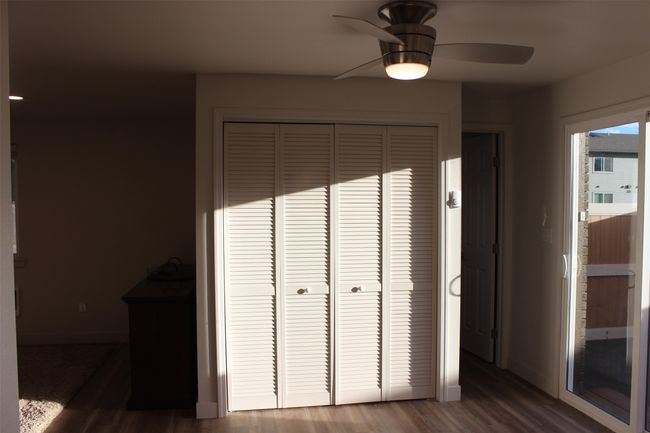 Detailed view of wood finished floors and ceiling fan | Image 8