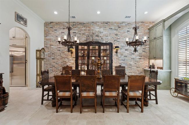 The Dining Room is large and inviting, welcoming any sizedinner party! Gorgeous Old Chicago Brick accent wall. | Image 4