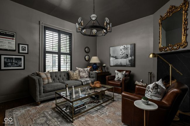 Den with hardwood floors, a chandelier, fireplace - could also be used as a 3rd bedroom. | Image 7