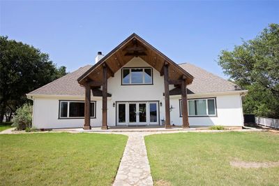 View of front of home featuring central AC and a front lawn | Image 1