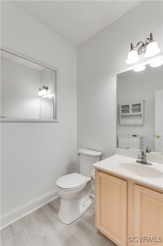 Half bathroom with wood finished floors and vanity | Image 24
