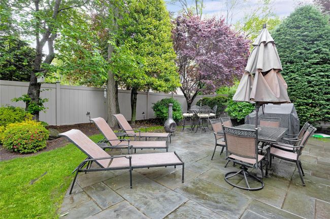 View of patio / terrace with outdoor dining space and a fenced backyard | Image 25