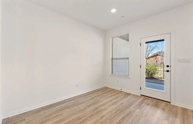 Spare room with light wood finished floors, baseboards, and recessed lighting | Image 13