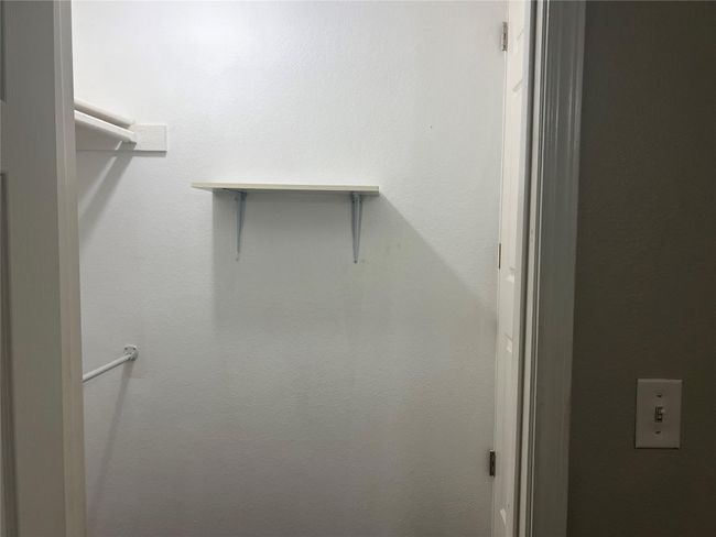 View of spacious closet | Image 11