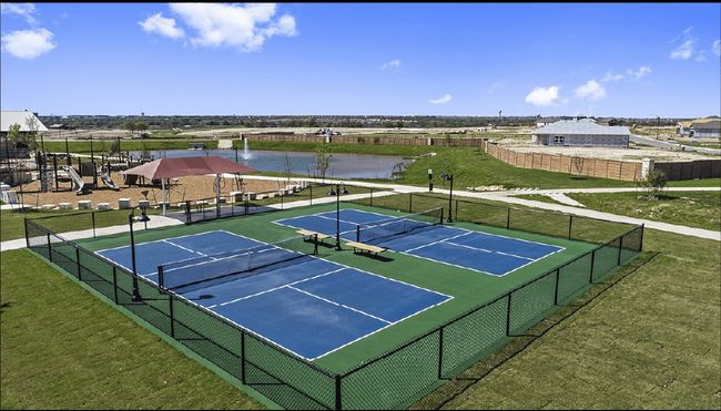 View of tennis court with a water view | Image 22