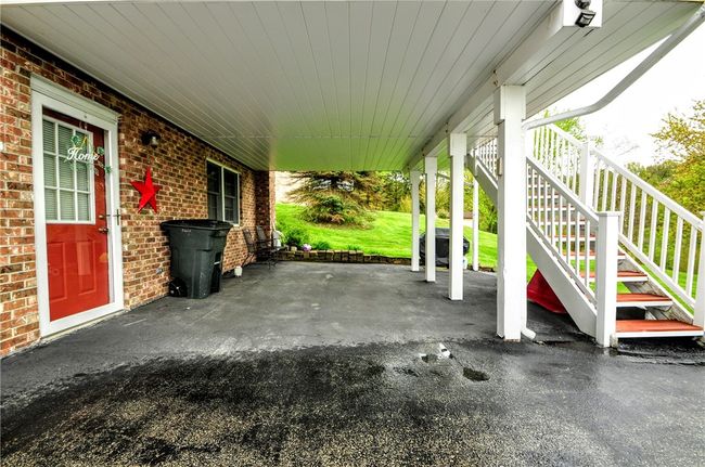 Your carport with access to the game room and also stairs to the sun room! | Image 44